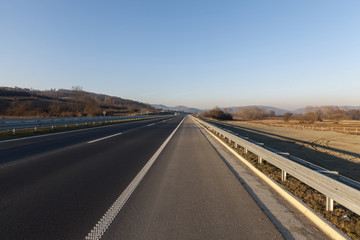 Fototapeta premium empty highway at sunset