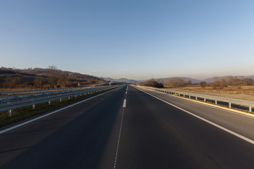 empty highway at sunset