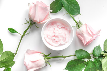 organic cream with rose oil on white background top view