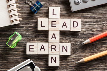 Conceptual business keywords on table with elements of game making crossword