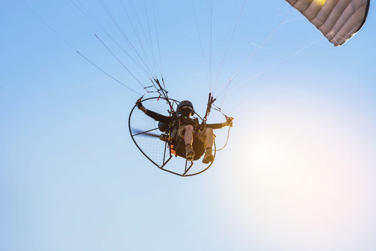 paraglider flying  with paramotor 