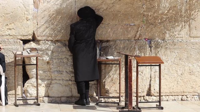 An Orthodox Jew Praying At The Western Wall In Jerusalem Israel