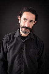 Handsome man doing different expressions in different sets of clothes: thinking