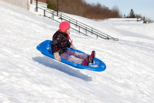 Sledding Girl Flying Down Hill