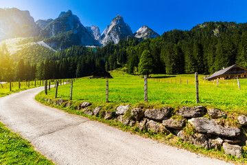 Sunny summer morning on the Gosau Lake (Vorderer Gosausee). Colorful outdoor scene in Upper Austrian Alps, Salzkammergut region, Austria, Europe. Artistic style post processed photo.