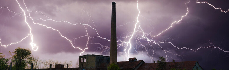 Thunder, lightnings and storm over abandoned factory in summer