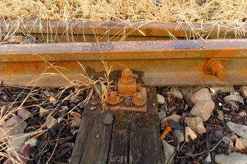 rusty screw in rails