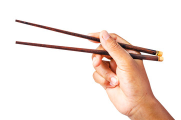 Person 's right hand using bamboo chopsticks.