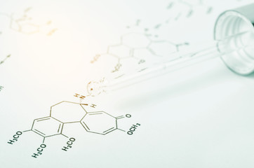 Laboratory glass Pipette on Chemical formula.