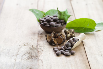 dried capsule seeds fruit of Sacha Inchi peanut on wooden