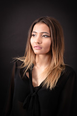 Naklejka premium Beautiful woman doing different expressions in different sets of clothes: thinking