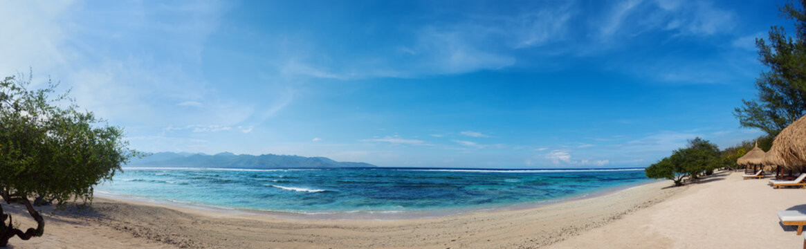 Panorama of tropical beach with blue ocean