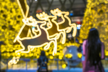 Blur colorful bokeh background of light decorate at night in Christmas and new year festival Bangkok city. 