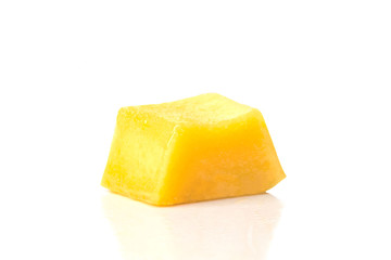 a delicious juicy yellow square piece of mango