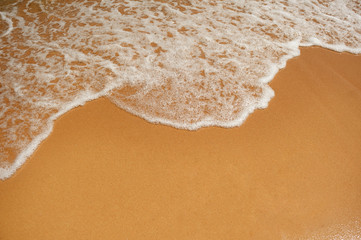 Fototapeta na wymiar wave and sea sandy beach texture