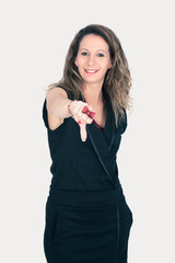 Fototapeta premium Beautiful woman doing different expressions in different sets of clothes thumbs down