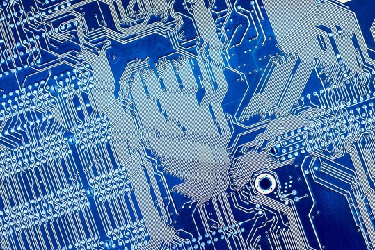 computer motherboard blue color as the background of IT technology