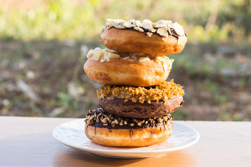 Stack donuts on wooden background