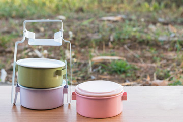 Food carrier colorful on a wooden