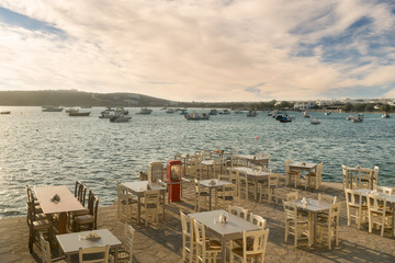 Greek restaurants and taverns are ready to welcome tourists at Alyki village in Paros island.
