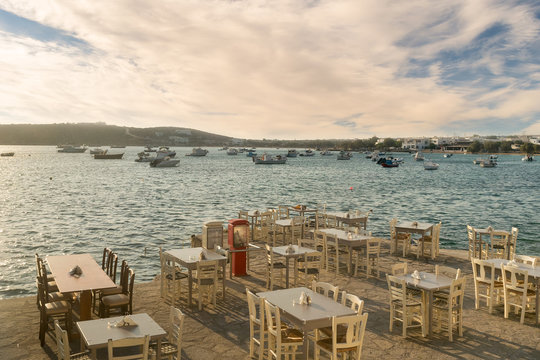 Greek restaurants and taverns are ready to welcome tourists at Alyki village in Paros island.
