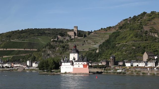Castle Pfalzgrafenstein  situated on an island in the middle of the Rhine (Germany). In the background the town Kaub with the castle Gutenfels.