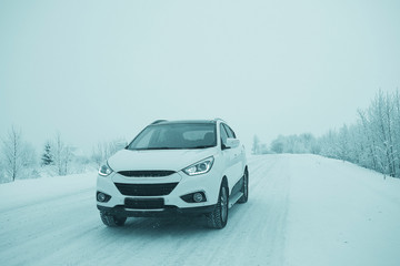 Obraz na płótnie Canvas car in a snowy landscape nature white winter snow