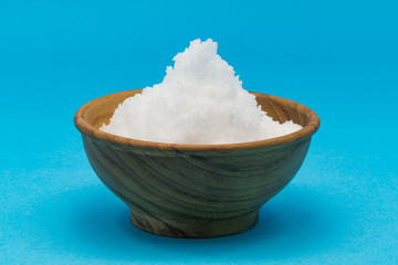 White sea salt in a wooden bowl