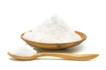 Fototapeta na wymiar White salt in wooden plate and wooden spoon