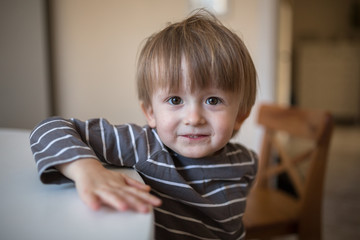 blond Toddler boy in  kitchen , childhood, real interior