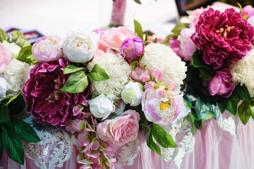Flower decor on wedding table bride and groom in restaurant