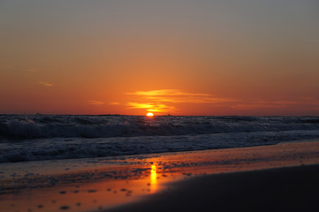 Fototapeta na wymiar Sunset reflecting in the sand