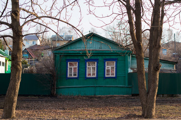 Fototapeta na wymiar Facade of the old wooden Green House in Russia