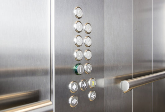 In the elevator floor buttons