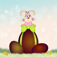 Easter rabbit with chocolate egg