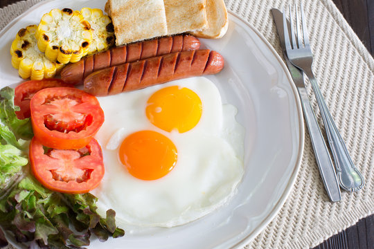 American breakfast with vegetables in white dish