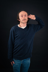 Handsome man doing different expressions in different sets of clothes: at attention