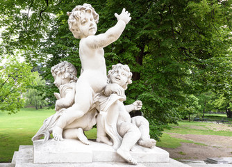 Fototapeta premium Photo statues of cherubims in burggarten near hofburg palace, vienna, austria