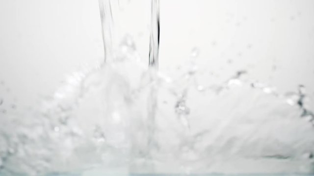 side vie of pouring clear water in 180fps slow motion, prores footage