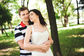 Fototapeta premium lovely happy couple at summer park