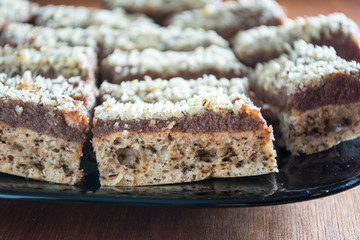 Chocolate cake with walnut cut into squares