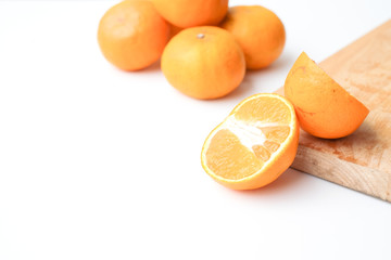 Half orange fruit on white background, fresh and juicy