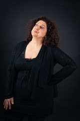 Fototapeta premium Beautiful woman doing different expressions in different sets of clothes: bored