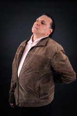Fototapeta premium Handsome Man doing different expressions in different sets of clothes: backache