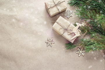 Christmas gifts,wooden decorations and branches on brown wrappin
