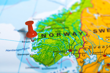 Bergen in Norway pinned on colorful political map of Europe. Geopolitical school atlas. Tilt shift effect. © bennymarty
