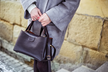 fashionable woman with brown leather bag