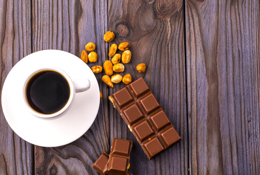 mug of coffee and chocolate with nuts