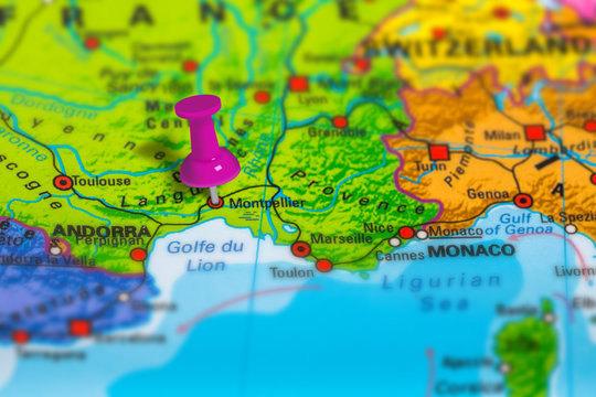montpellier in France pinned on colorful political map of Europe. Geopolitical school atlas. Tilt shift effect.
