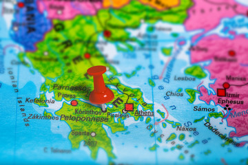 Korinthos in Greece pinned on colorful political map of Europe. Geopolitical school atlas. Tilt shift effect.